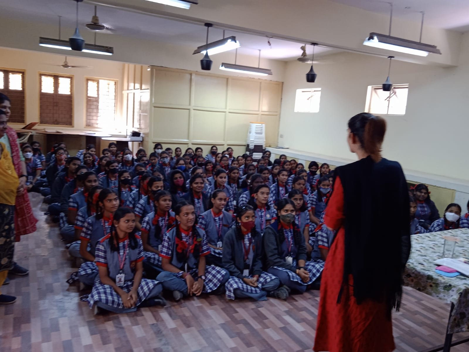 A Care-O-Safe educator leading a menstrual health talk in a school classroom