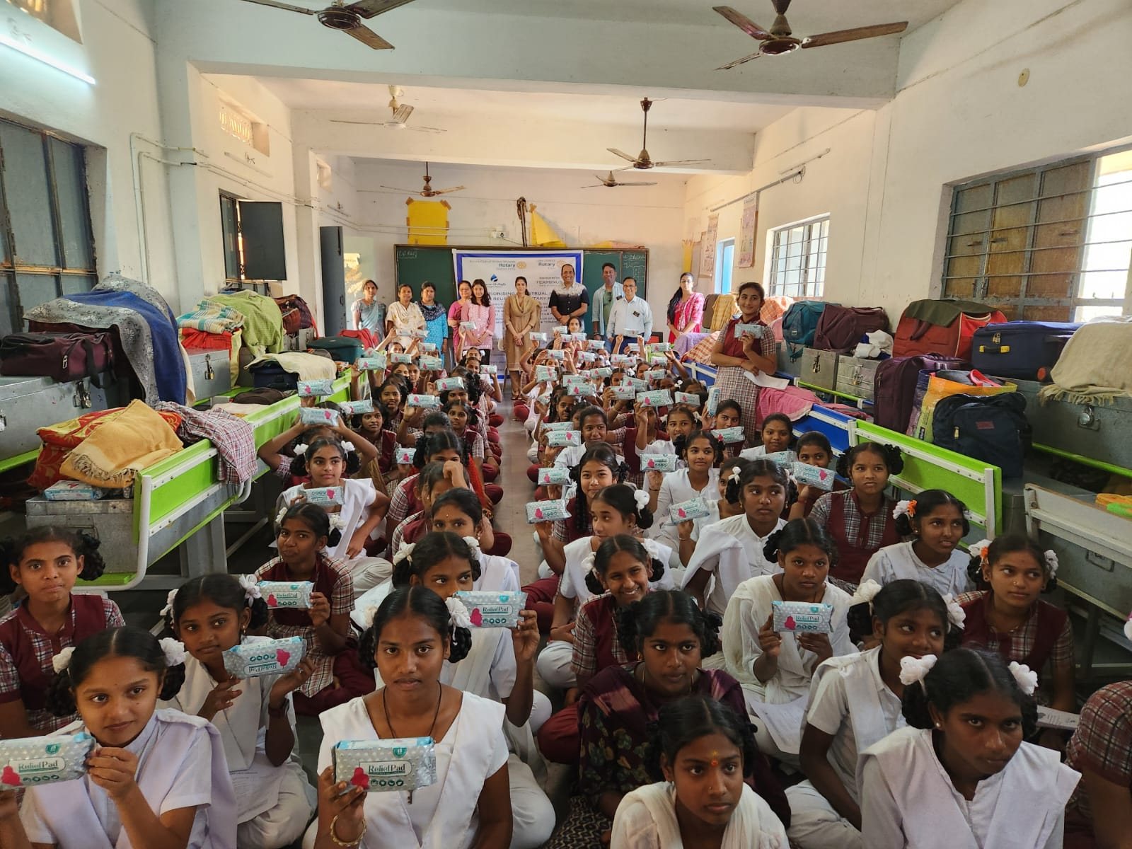 A Care-O-Safe session underway in a large hostel dormitory hall